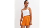 Girls Light Coral Crinkle Texture Lettuce Trim Shorts